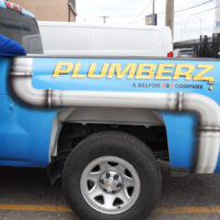 PLUMBERZ truck and worker