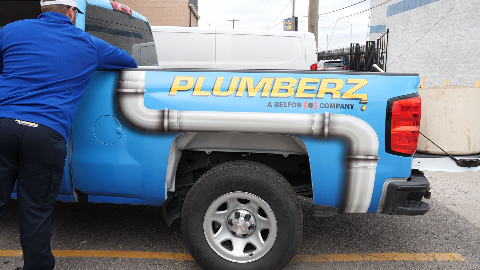 PLUMBERZ truck and worker