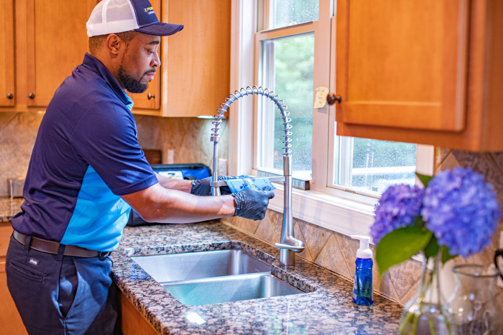 Z PLUMBERZ franchise owner works on kitchen sink how to create generational wealth